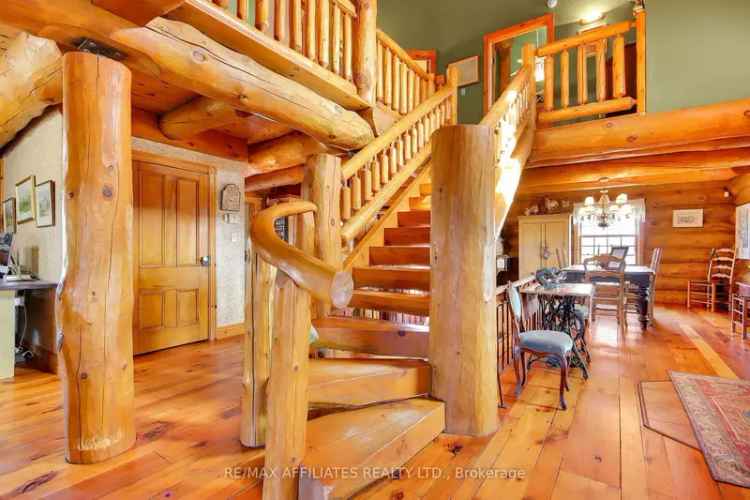 Beautiful custom log home for sale on 53 acres in Brockville