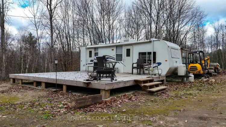 Buy land with recreational trailer in peaceful setting