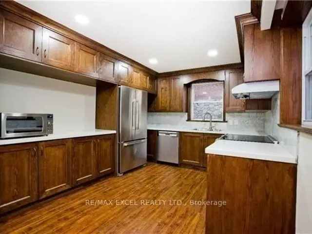 Raised Bungalow with Finished Basement and Sunroom