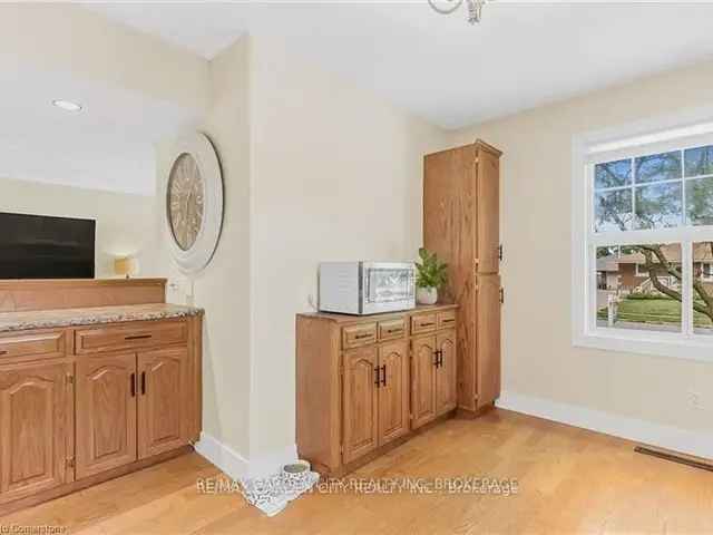 Charming 2 1 Bedroom Home with Finished Basement and Backyard Pond