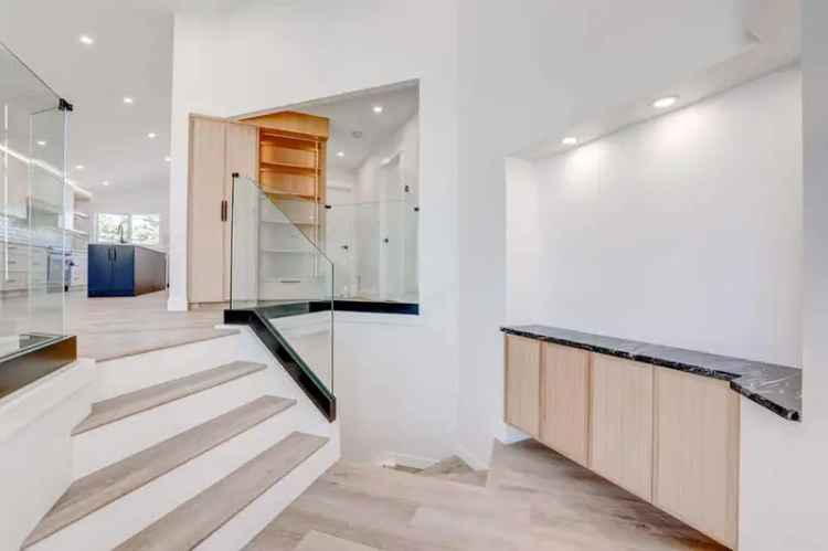 Fully Renovated 5 Bed 4 Bath Bilevel with Legal Suite and Garage