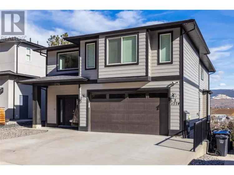 Buy 7 Bedroom Home in North Glenmore with Mountain Views and Legal Suite