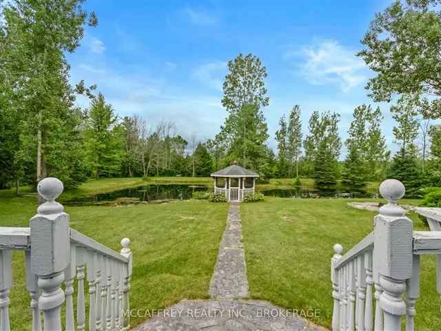 1.5 Story Home on 15 Acres with Pond and Garage