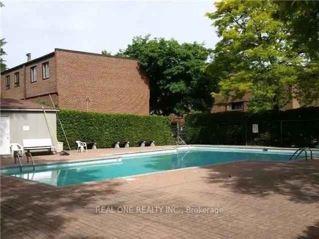 Buy Townhouse in Hillcrest Village with Fenced Backyard and Pool