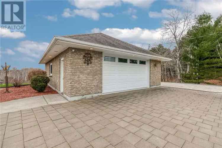 Val Caron Bungalow: 1-Acre Lot, Spacious Layout, Triple Car Garage