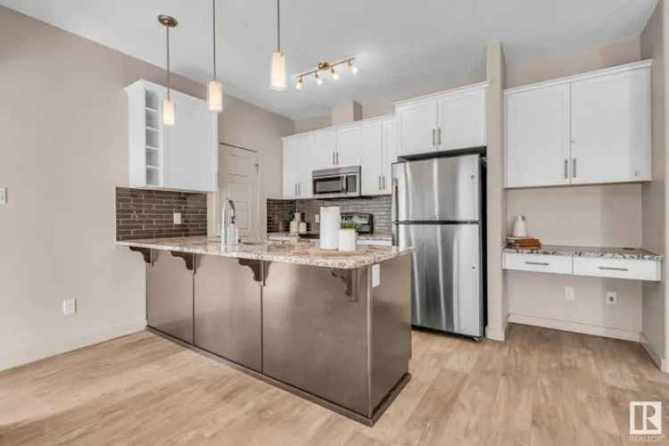 Buy Condo in Ambleside with Private Patio and Modern Kitchen