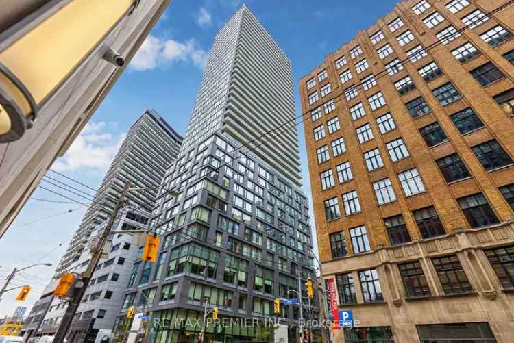 Downtown 1 Bedroom Condo with Den and Modern Amenities