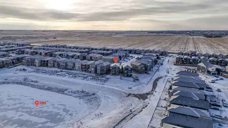 Buy two-story house in Calgary NE with walk-out basement and pond views