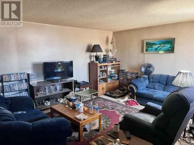 3-Unit Zoned Property with Garage and Backyard Potential
