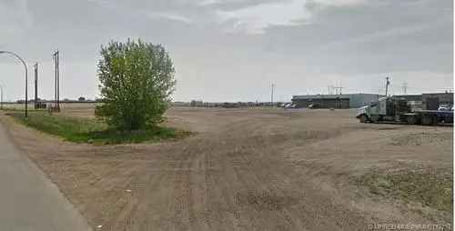 Vacant land for sale in Medicine Hat with industrial zoning features