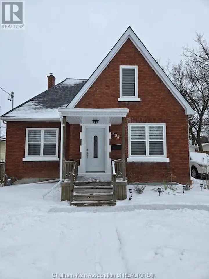 Charming Classic 1.5 Storey Brick Home in Quiet Neighbourhood