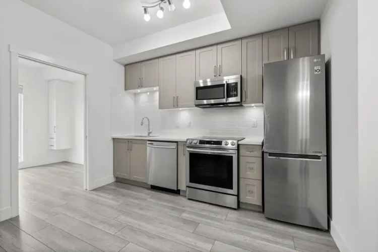 Modern 1-Bedroom + Den Condo in Surrey's Fraser Landmark