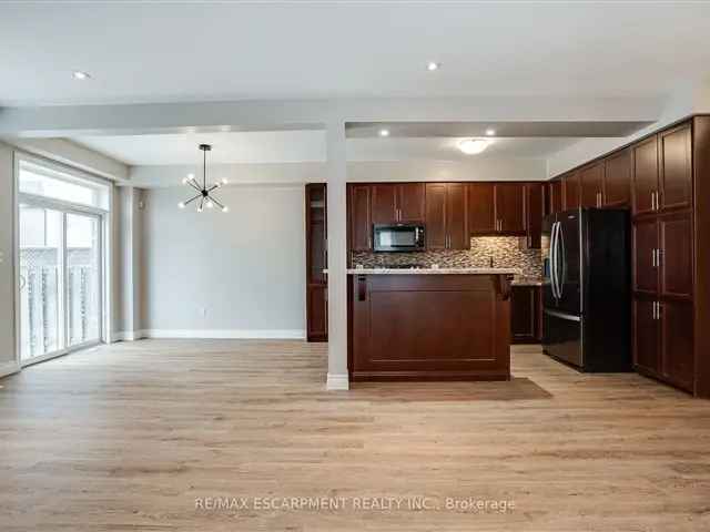 Lake Ontario 3-Bedroom Townhome with New Flooring and Backyard