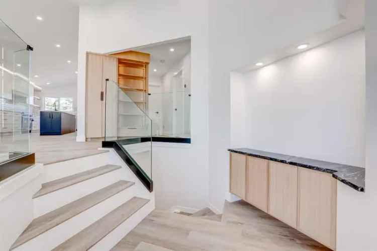 Fully Renovated 5 Bed 4 Bath Bilevel with Legal Suite and Double Garage