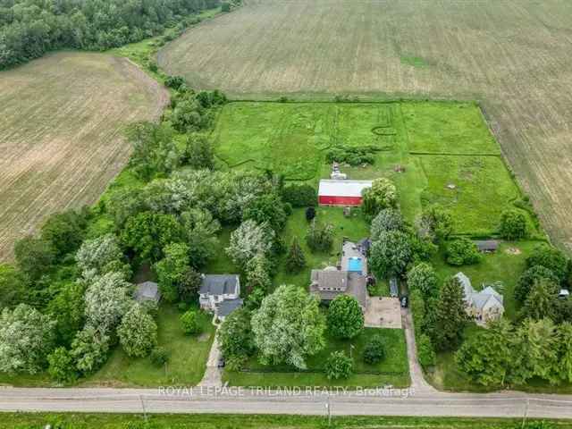 Stunning 8 Acre Country Home with Pool, Shop & Finished Basement