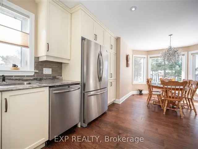 Move In Ready Home with Hardwood Floors Gas Fireplace and Triple Garage