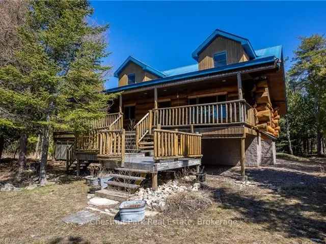 Grand Log Home with Expansive Windows and Covered Porch