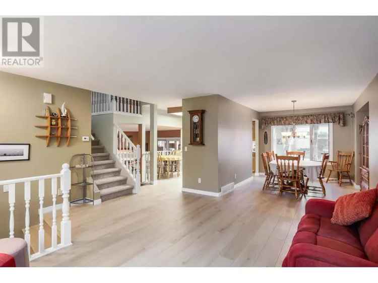 Buy Detached Home in Glenmore Kelowna with Shop and Sunroom