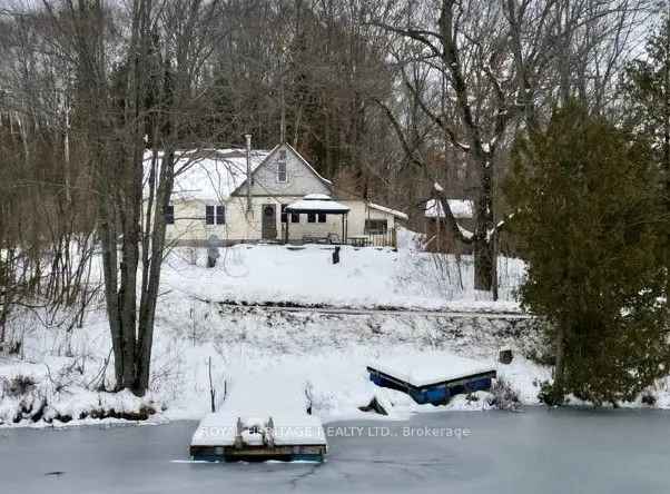 Waterfront Property with Lake Views - Renovation Opportunity