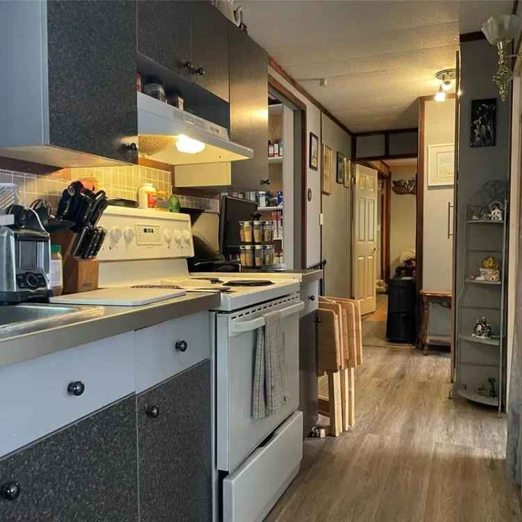 Buy Manufactured Home in Parksville with Entertaining Deck and Ensuite