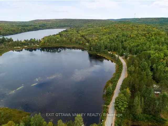 Lakefront Vacant Lot with Garage Septic Hydro and Well Near Boulter Lake