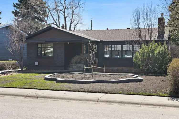 Brentwood Bungalow:  Rebuilt with Stonework, Heated Garage & Deck Patio