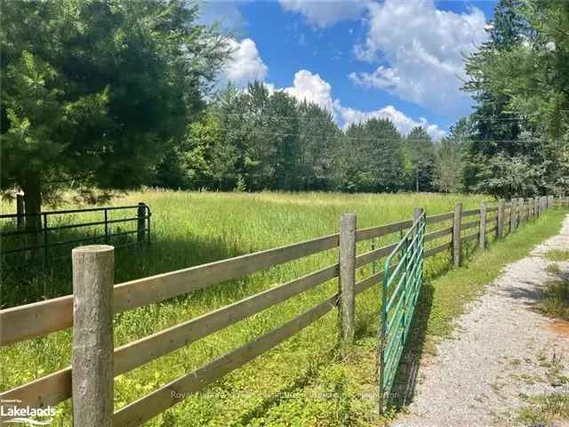 10-Acre Riverfront Property with Barn on Burnt River