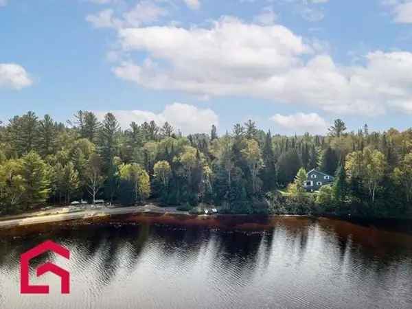 16.5-Acre Estate with Private Sandy Beach and Chalet