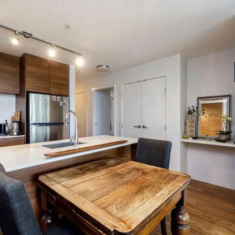 1 Bed + Den Suite at District Crossing - Large Patio