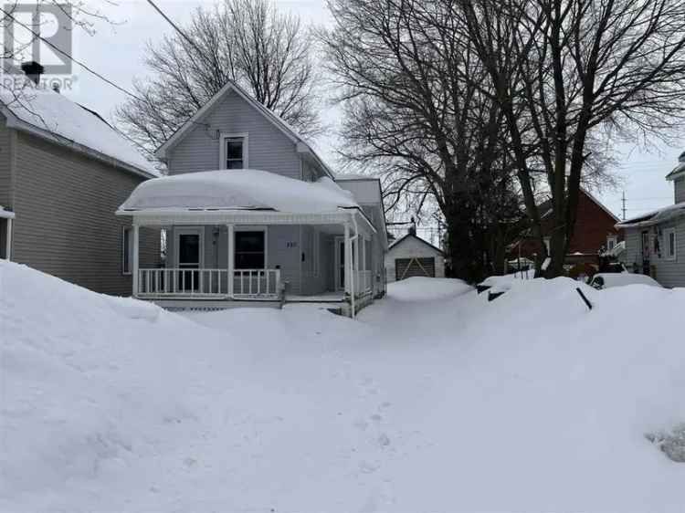 Buy home in walking distance to amenities with great front porch in Canada