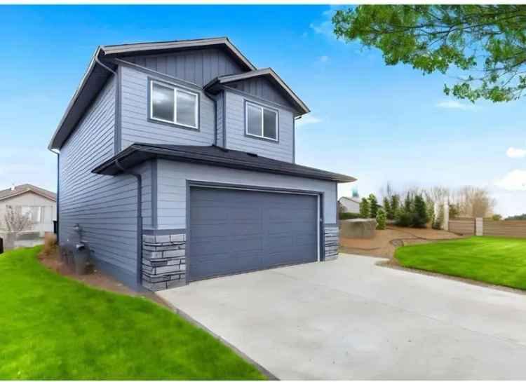 Buy Detached Home in Carstairs with Family-Friendly Features