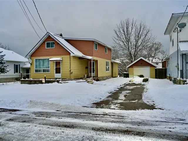 Large 4-Bedroom Home with Detached Garage and Main Floor Laundry