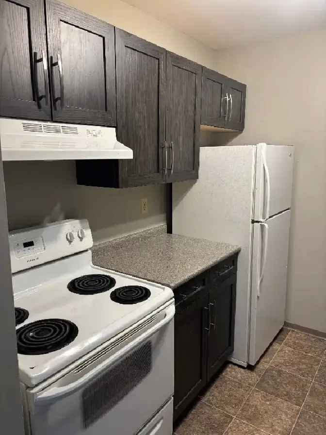 Rent 2 Bedroom Apartment in Gardens at Twin Lakes with In-suite Laundry