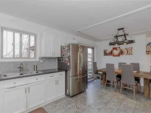 West Brant Raised Bungalow: Double Garage, Finished Basement, Large Lot