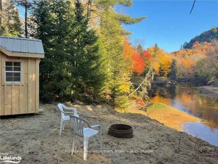 34 Acres Wooded Riverfront Paradise near Huntsville