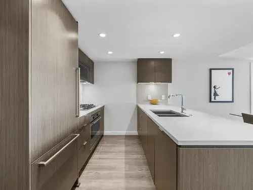 1 Bed + Den Condo in Central Lonsdale with City & Ocean Views