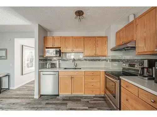 Townhouse for Sale in Varsity Calgary with 3 Bedrooms and Backing onto Green Space