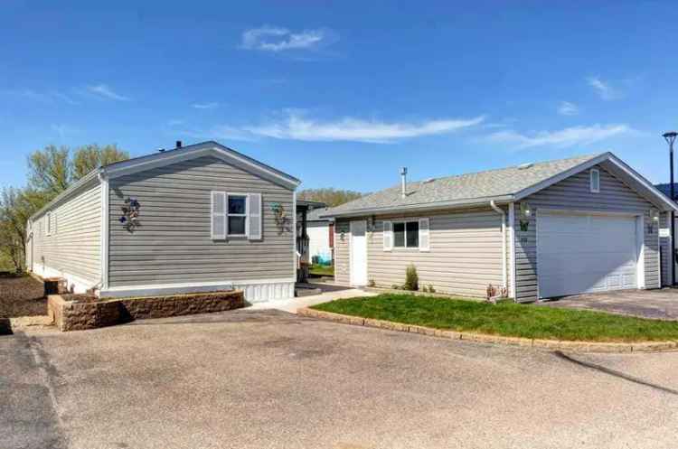 55+ Ranch Estates Home: Move-In Ready with Double Garage & Central A/C