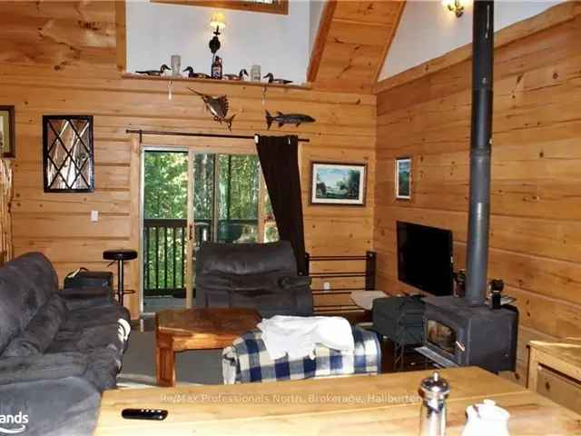 Confederation Log Home with Walkout Basement and Covered Deck