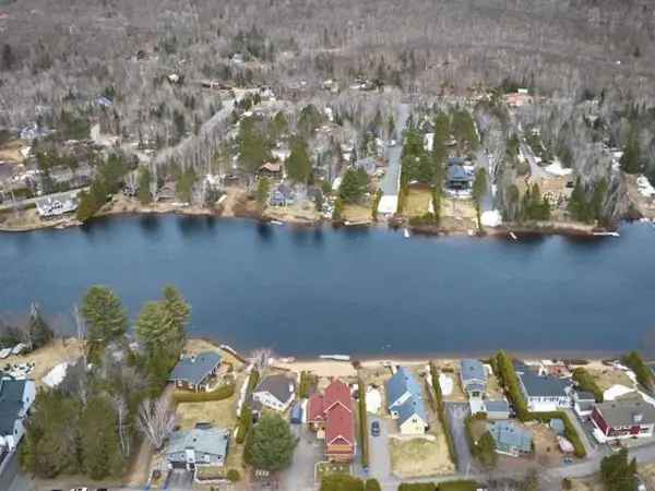 Riverfront Property in Saint Donat with Private Beach and Mountain Views