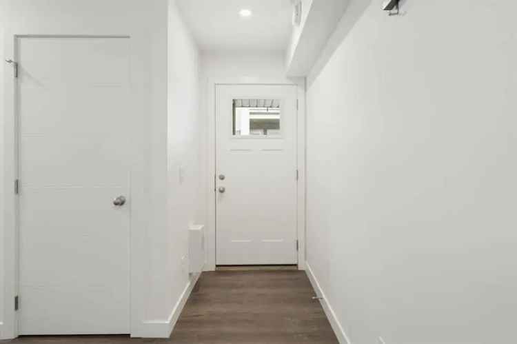Springbank Hill Top Floor Corner Unit with Garage and BBQ Line