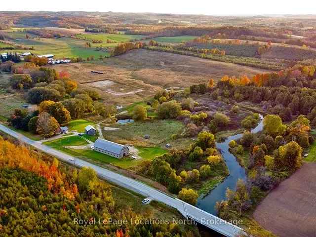 130 Acres Riverfront Equestrian Estate with Barn and Farmland