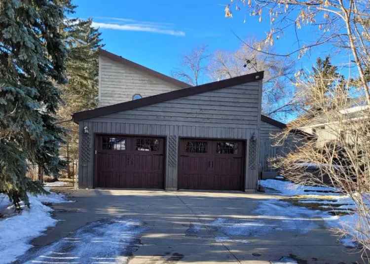 Lakefront Home near Calgary with Stunning Sunsets and Multiple Recreation Rooms