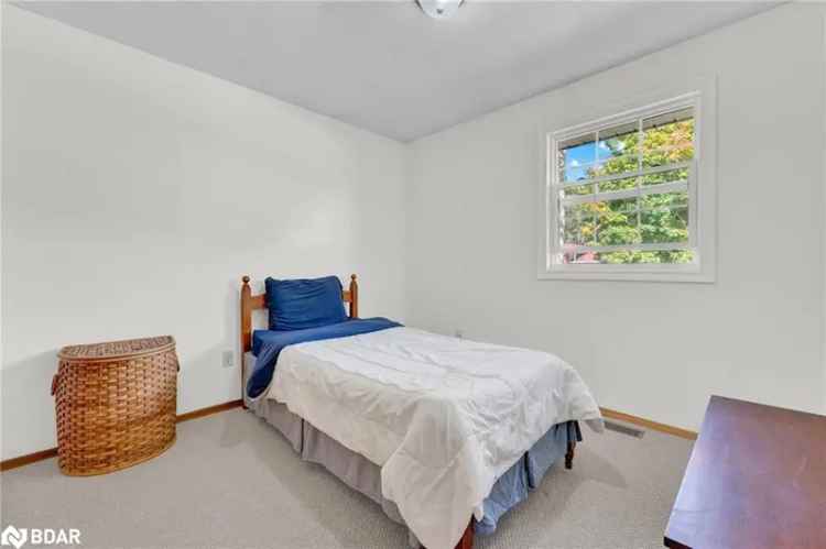 Buy Raised Bungalow in Creemore with Private Backyard and Family Features