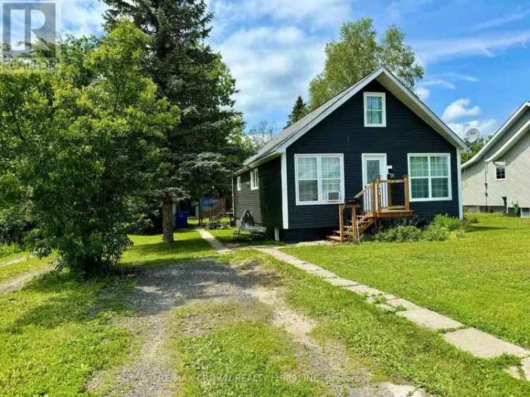 Charming 1.5 Storey Home with Updated Kitchen and Sunroom