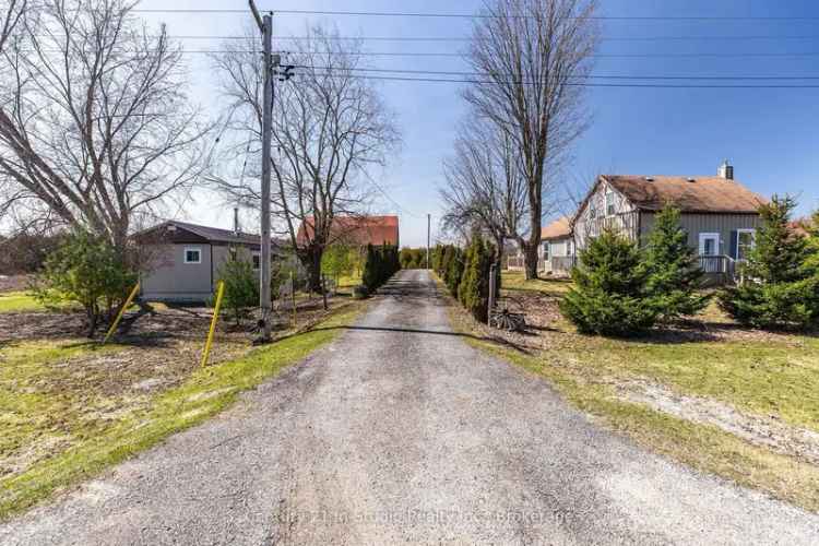Versatile 6.2 Acre Property with Barn, Garages & Two Homes Near Lakes