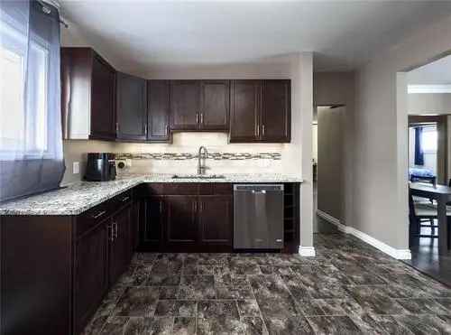 Buy House in Robertson Winnipeg with Stylish Kitchen and Finished Basement