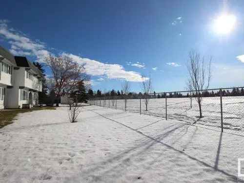 Buy Townhouse in Skyrattler Edmonton with Park Views and Renovated Features