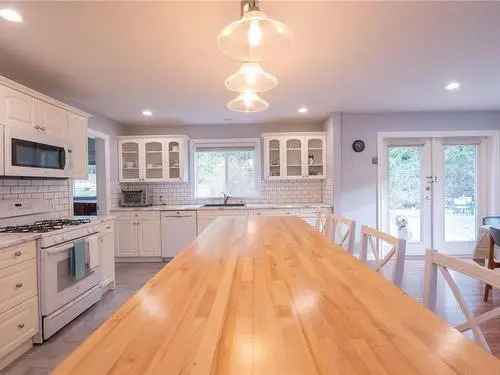 Buy House in Nanaimo with Renovated Kitchen and Spacious Outdoor Area