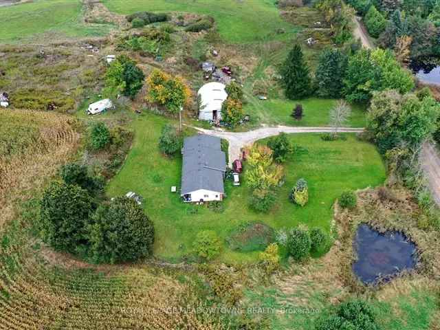 98-Acre Property with 3-Bedroom Bungalow and Outbuilding